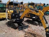 2024 Komatsu PC18 mini excavator, rear three-quarter view