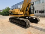 2015 Caterpillar 320BL crawler excavator, rear three-quarter view