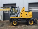 2011 New Holland WE150C wheel excavator, side profile view