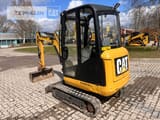 2016 Caterpillar 301.7D mini excavator, rear three-quarter view