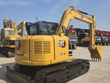 2023 Caterpillar 308.5E2 mini excavator, rear three-quarter view