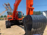 Doosan DX300 crawler excavator front view with bucket