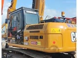 2023 Caterpillar 315D2 crawler excavator, rear three-quarter view