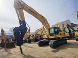 2019 Komatsu PC450-8 crawler excavator with hydraulic breaker attachment, front three-quarter view