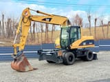 2003 Caterpillar M315C wheel excavator, front three-quarter view