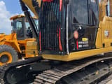 2023 Caterpillar 320GC crawler excavator, front three-quarter view