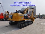 2024 Caterpillar 323DL crawler excavator, rear three-quarter view