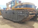 2010 Caterpillar 320C amphibious excavator, rear three-quarter view