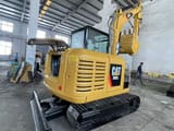 2023 Caterpillar 306E2 mini excavator rear three-quarter view