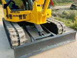 2023 Komatsu PC55 mini excavator front view with blade