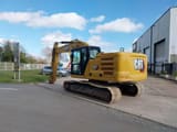 2021 Caterpillar 323 crawler excavator, rear three-quarter view