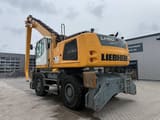 2019 Liebherr LH50 material handler, rear three-quarter view