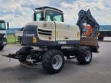 2017 Schaeff TW95 wheel excavator, rear three-quarter view