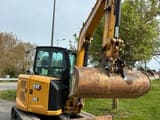 2024 Caterpillar 305 mini excavator, front three-quarter view