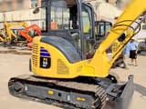 Komatsu PC55MR-2 mini excavator, side view
