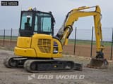 2024 Komatsu PC55MR-5 mini excavator, rear three-quarter view