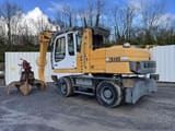 2012 Liebherr 316 material handler, side view