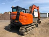 2023 Hitachi ZX95USBRP-7 crawler excavator, rear three-quarter view