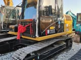 2022 Caterpillar 312D2 crawler excavator, side view of cab and tracks