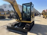 2024 Caterpillar 305.5E2 mini excavator, front three-quarter view