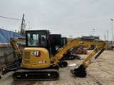 2023 Caterpillar 303.5E mini excavator, side view