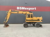 1992 Caterpillar 214B wheel excavator, side profile view
