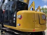 2024 Caterpillar 307E excavator, rear three-quarter view