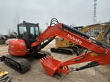 2024 Kubota U55-4 mini excavator, side profile view