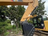 2023 Caterpillar 308E2 crawler excavator, side view of boom and bucket