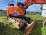 2017 Doosan DX140LCR-5 crawler excavator, side view of the undercarriage and blade