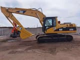 2010 Caterpillar 325C crawler excavator, side profile view