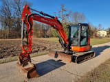 2015 Kubota KX057-4 mini excavator, front three-quarter view