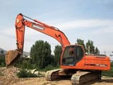2022 Doosan DX225LC crawler excavator, side profile view