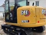 2023 Caterpillar 307E2 crawler excavator, rear three-quarter view