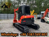 2024 Kubota U55-4 mini excavator, front three-quarter view