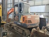 2015 Doosan DH55 mini excavator, rear three-quarter view