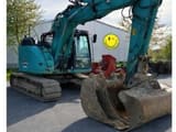 2016 Kobelco SK140SRLC-5 crawler excavator, front three-quarter view