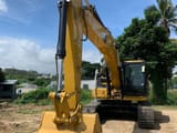 2025 Caterpillar 323D3 crawler excavator, front three-quarter view