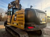 2019 Caterpillar 320 crawler excavator, rear three-quarter view