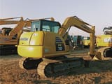 2024 Komatsu PC70-8 mini excavator, rear three-quarter view