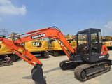 2021 Doosan DH55 mini excavator, side view