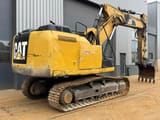 2012 Caterpillar 323E crawler excavator, rear three-quarter view