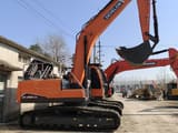 2024 Doosan DX225LCA crawler excavator, side view