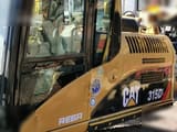 2019 Caterpillar 315DL crawler excavator cab and side panel view