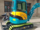 2023 Kubota U25 mini excavator, rear three-quarter view