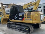 2023 Caterpillar 320D2 L crawler excavator, rear three-quarter view