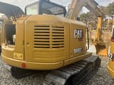 2023 Caterpillar 308E2 crawler excavator, rear three-quarter view