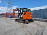 2023 Hitachi ZX85USBR-6 2PB mini excavator, rear three-quarter view