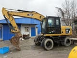 2022 Caterpillar M315D2 wheel excavator, side profile view