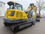 2025 Wacker Neuson ET90 mini excavator, rear three-quarter view